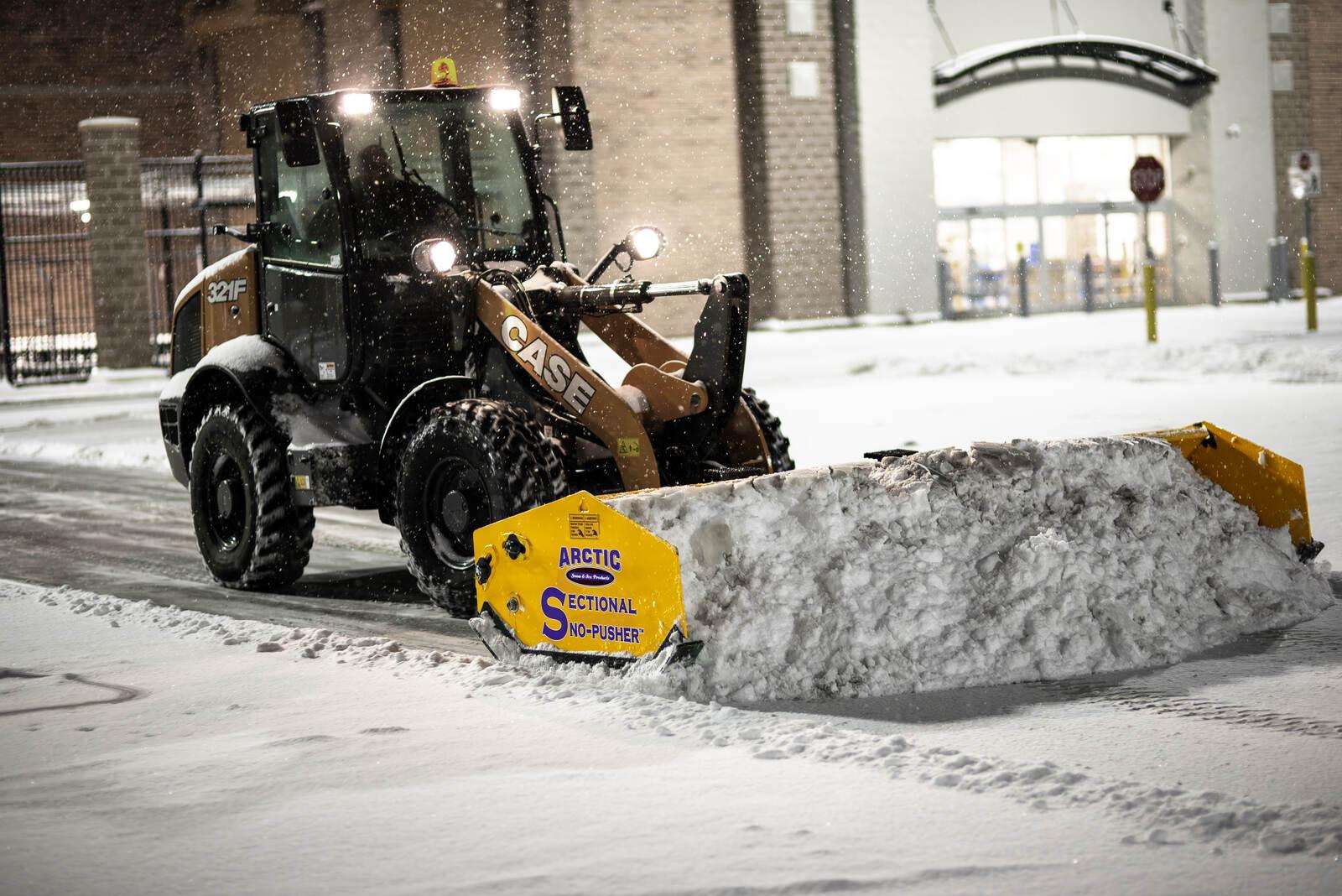 Arctic Sno-Pusher on a compact loader