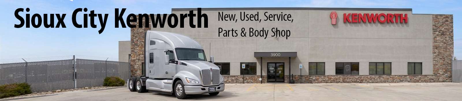 Sioux City Kenworth dealership storefront with a new silver Kenworth semi-truck parked in front — New, Used, Service, Parts & Body Shop