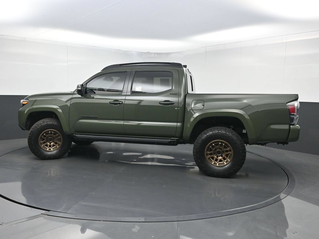 Side profile of a used 2021 Toyota Tacoma double cab short bed
