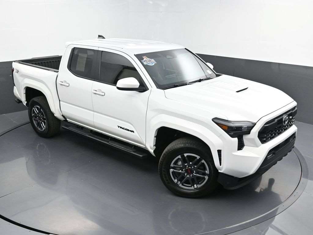 Used 2024 Toyota Tacoma in white, front three-quarter view, at Driver's Way in Birmingham, AL