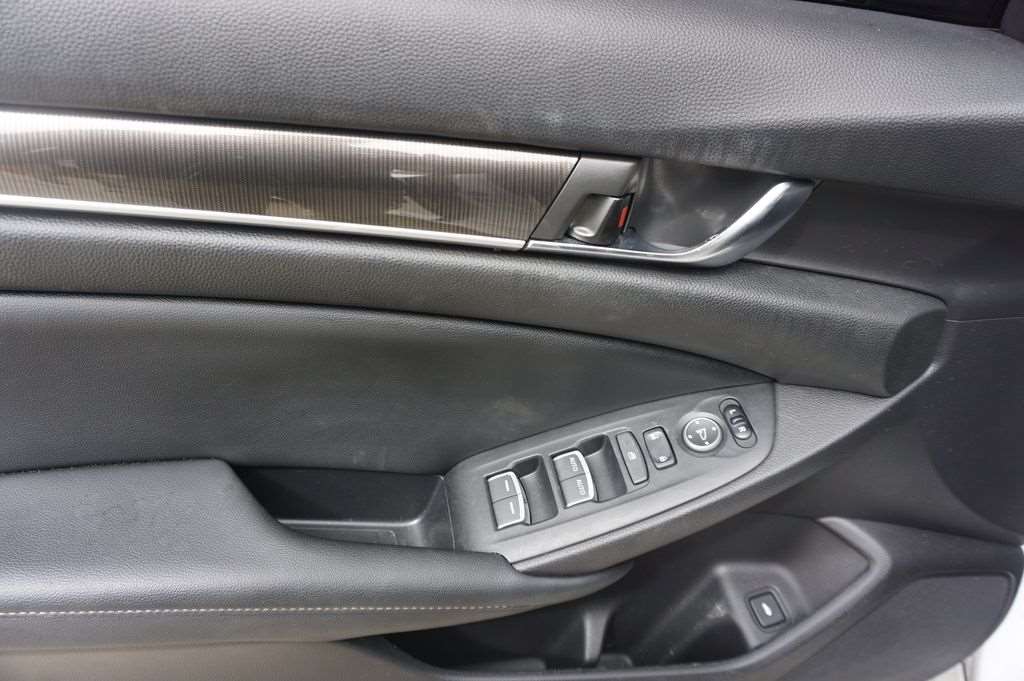 Interior door panel and controls of a used Honda Accord at Driver's Way