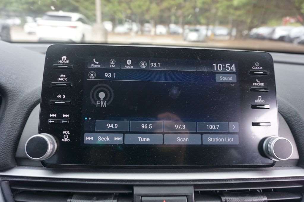 Infotainment screen and dashboard controls in a used Honda Accord at Driver's Way on Hwy 280