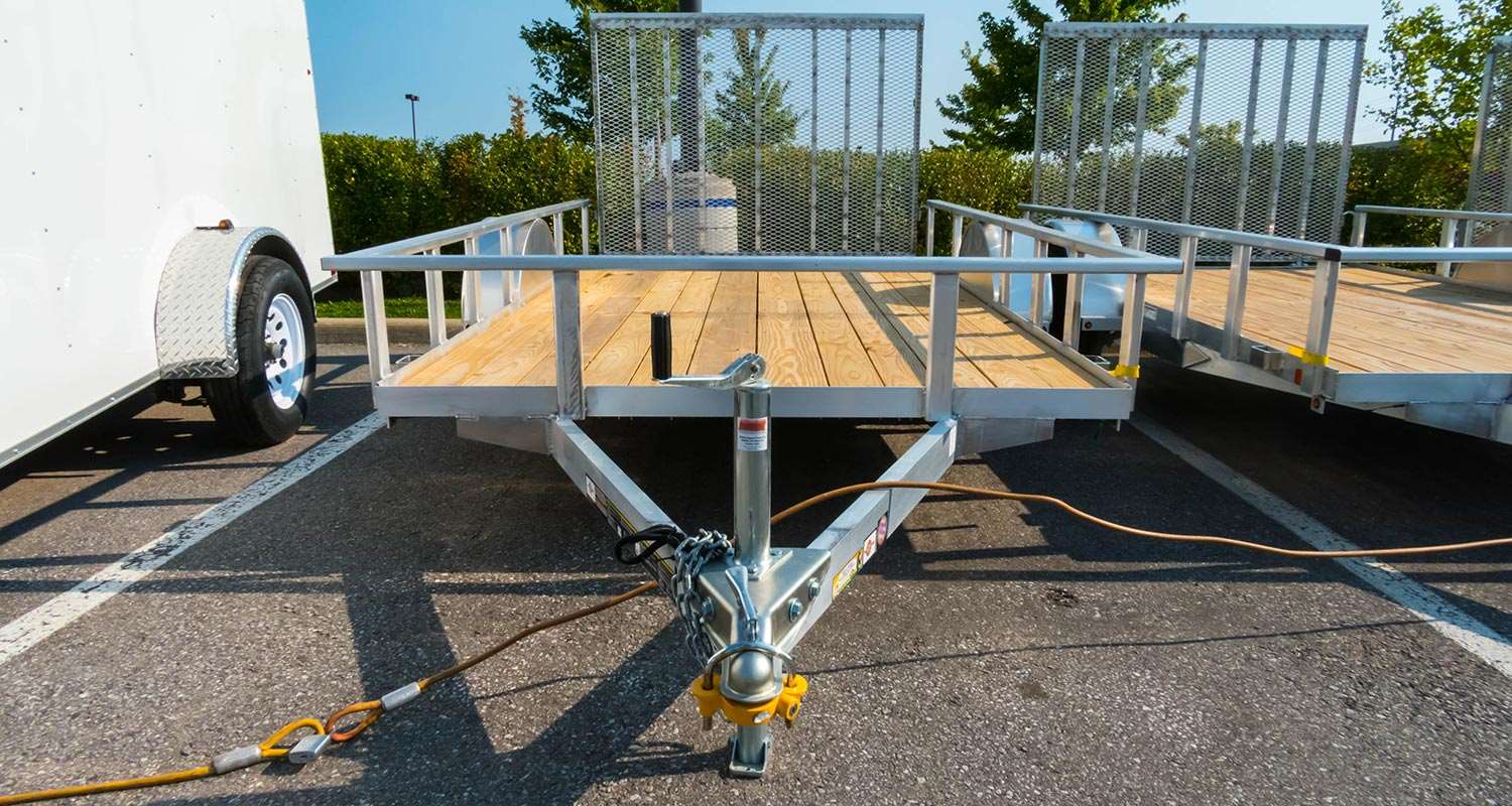 A row of trailers in a parking lot.