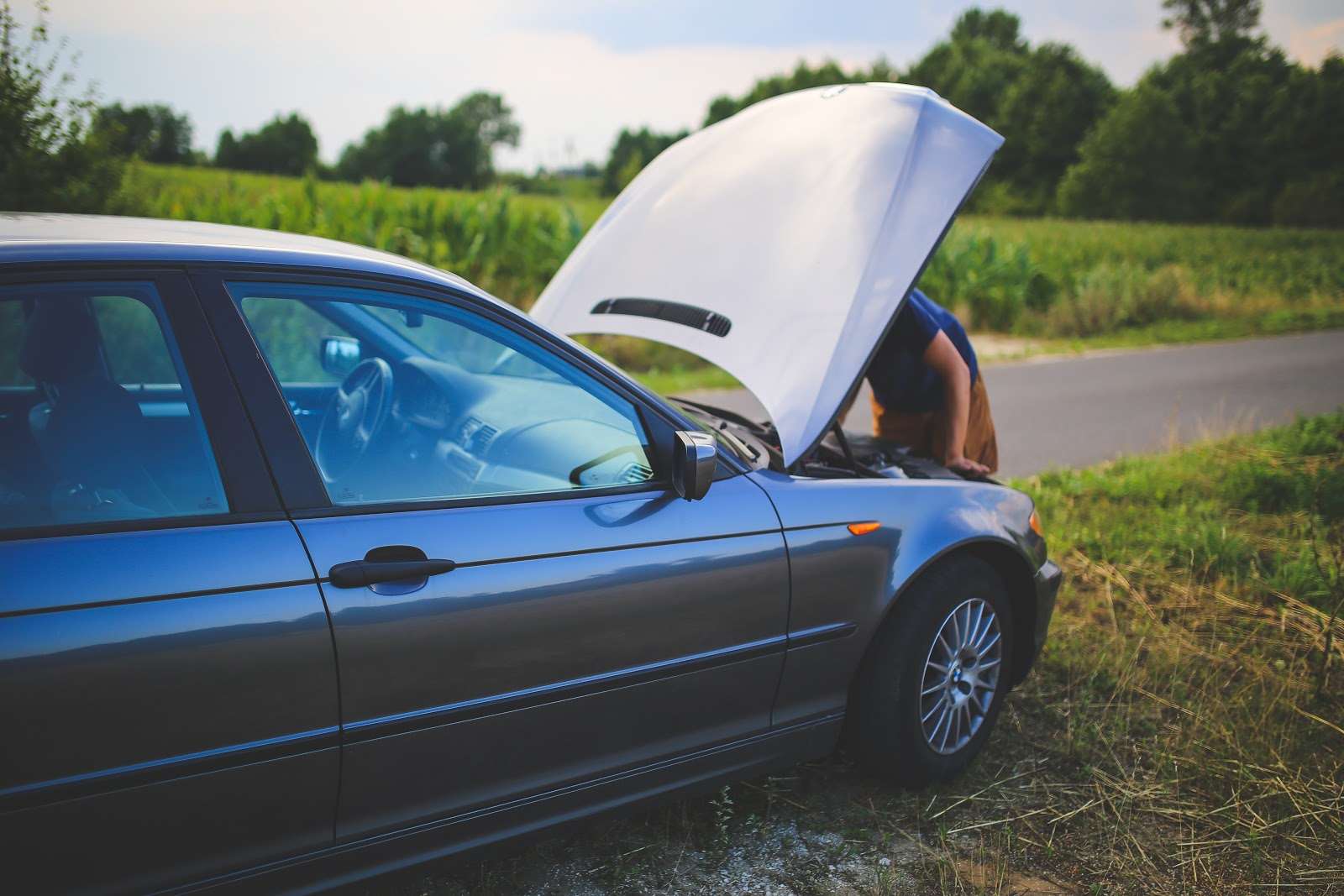 Broken down car summer travel tips