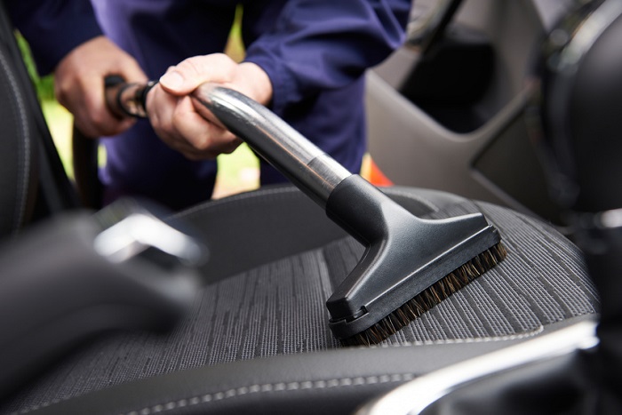 Vacuuming a car seat